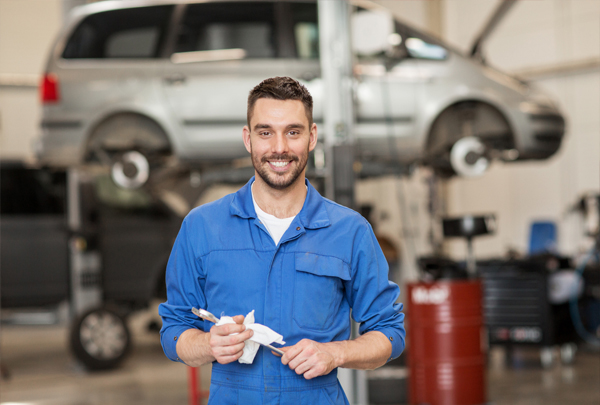 car mechanic holding a wrench